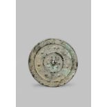 A CHINESE SILVERED BRONZE MIRROR HAN DYNASTY 206BC - 220AD Cast in shallow relief with birds and