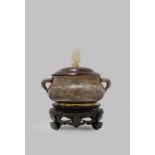 A CHINESE SILVER-WIRE INLAID BRONZE INCENSE BURNER QING DYNASTY The compressed ovoid body with two