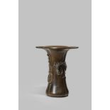 A CHINESE BRONZE VASE LATE MING DYNASTY The quatrefoil-section body with a broad flared rim, a