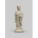 † A LARGE CHINESE BLANC DE CHINE STANDING FIGURE OF BUDDHA LATE MING DYNASTY With his right hand