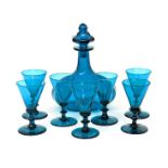 A part suite of glass 19th century, including a heavy faceted decanter and stopper, starcut to the