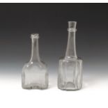 Two glass serving bottles or decanters c.1740, one of octagonal moulded form, the other cruciform,
