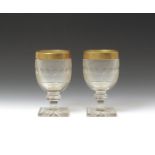 A pair of cut glass goblets late 19th century, attributed to Baccarat, the rounded bowls cut with