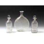 A pair of decanters and stoppers c.1800, the square forms moulded with a wide diamond panel above