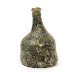 An English wine bottle c.1720, of mallet shape with string rim and kick-in base, the surface
