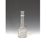 A cruciform glass serving bottle or decanter c.1740, of slight cruciform shape, the squat body