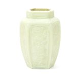 A hexagonal opaque glass vase 19th century, of a rich ivory colour, each panel finely carved with