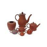 Six redware and Yixing stoneware teapots and covers 18th century and later, English, Chinese and