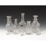 Five glass decanters late 18th/19th century, one with a tall diamond cut neck, two of mallet shape