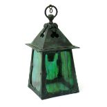 A patinated metal hall lantern, flaring square section, with rivet decoration, set with four