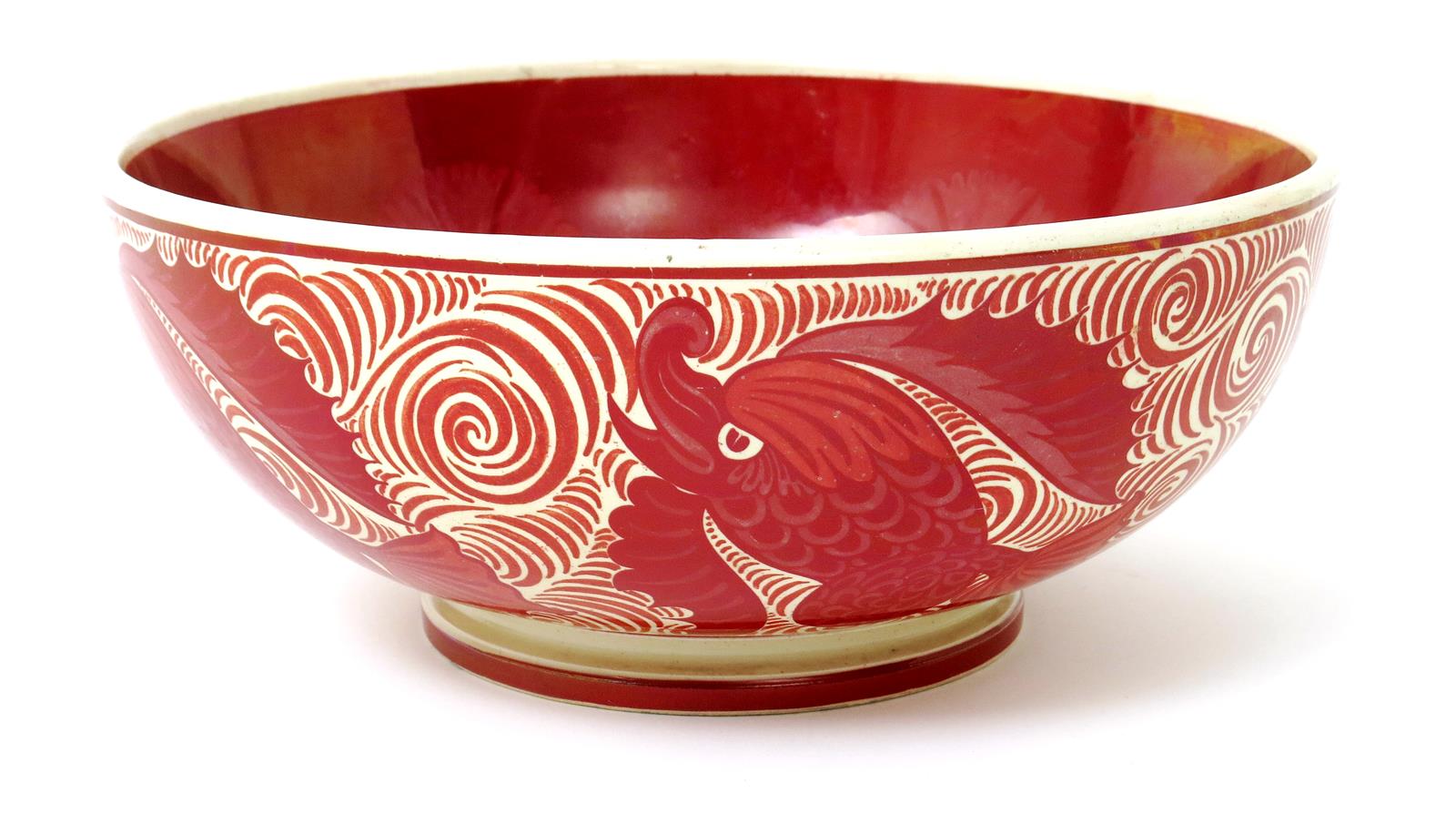 A William De Morgan footed bowl by Charles Passenger, painted to the exterior with scaly fish