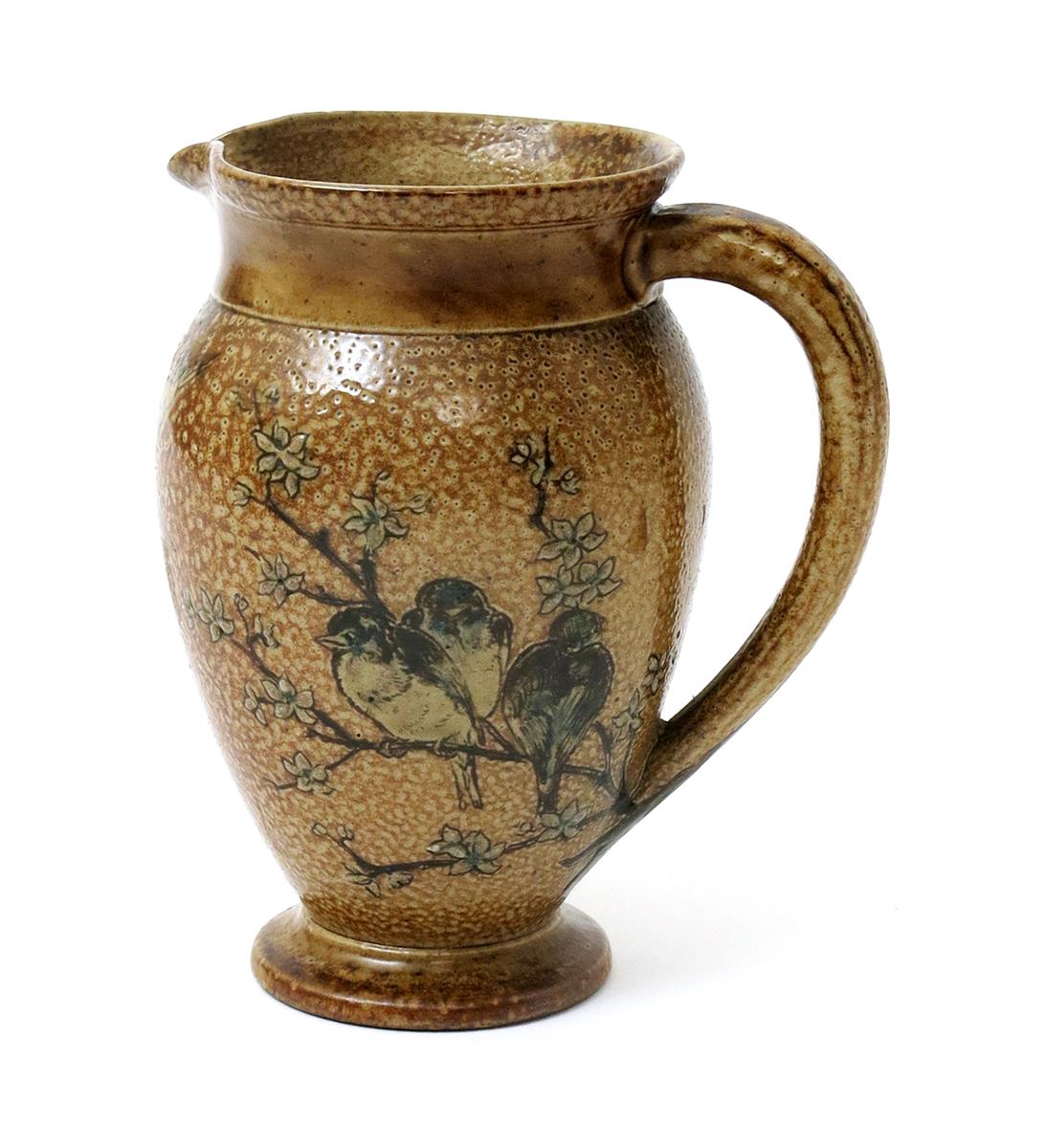 A Martin Brothers stoneware jug, shouldered form, incised with birds roosting on a tree bough, in