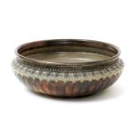 A Martin Brothers stoneware bowl by Robert Wallace Martin, dated 1886, low waisted form, incised