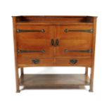 A J.A.S Shoolbred oak sideboard, twin hinged cupboard with internal shelf, above drawers,