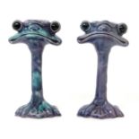 A pair of Baron Barnstaple grotesque candlesticks designed by Blanche Vulliamy, modelled a grotesque