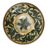 A Martin Brothers stoneware wall plate by Edwin & Walter Martin, dated 1893, incised with a