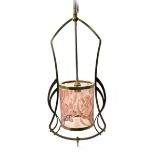 An Art Nouveau brass ceiling light with pink vaseline shade, the openwork light decorated with