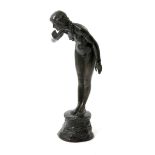 An Art Nouveau patinated bronze model of a naked maiden cast from a model by Alfred E Lewis (