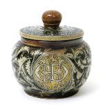 A Martin Brothers stoneware jar and cover, the shouldered ovoid jar incised with a roundel inscribed