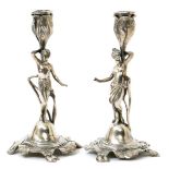 A pair of Art Nouveau W.M.F electroplated candlesticks, modelled with a man and woman standing and