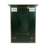A Guthrie & Wells green painted wardrobe in the style of Charles Rennie Mackintosh, architectural