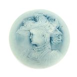 A Burmantofts Faience wall charger by Pierre Mallet, circular cast in low relief with a maiden in