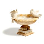 An Italian carved alabaster and Siena marble Grand Tour urn and four doves, after the Doves of