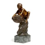 An Italian bronze model of a Neapolitan fisher-boy, crouching on a rock peering into a lobster