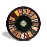 A 19th century Italian Grand tour specimen marble and micromosaic circular plaque, the centre with a