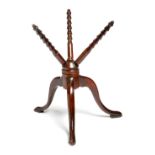 A George III turned treen cat, with three revolving ribbed spokes on a tripod base, 35cm high, 33.