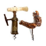 A Victorian King's pattern corkscrew, with a turned bone handle and with a brush, the bronze