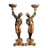 A pair of Italian Venetian carved pine and polychrome decorated blackamoor torchères, with