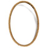 A George III Irish giltwood oval wall mirror frame, with an ovolu moulding and decorated with