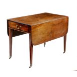 A George III mahogany Pembroke table, the drop-leaf top with a moulded edge, above a frieze