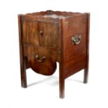 A George III mahogany bedside tray-top commode, with a wavy edge gallery, above cupboard doors and a