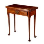 A small George II mahogany tea table, the solid top on a single gate support, with a frieze