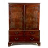 An early George III mahogany linen press in the manner of Philip Bell