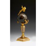 A French champlevé enamel and ormolu crystall ball stand, with an angel finial and an agate