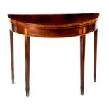 A George III mahogany demi-lune card table, the crossbanded fold-over top on a single gate