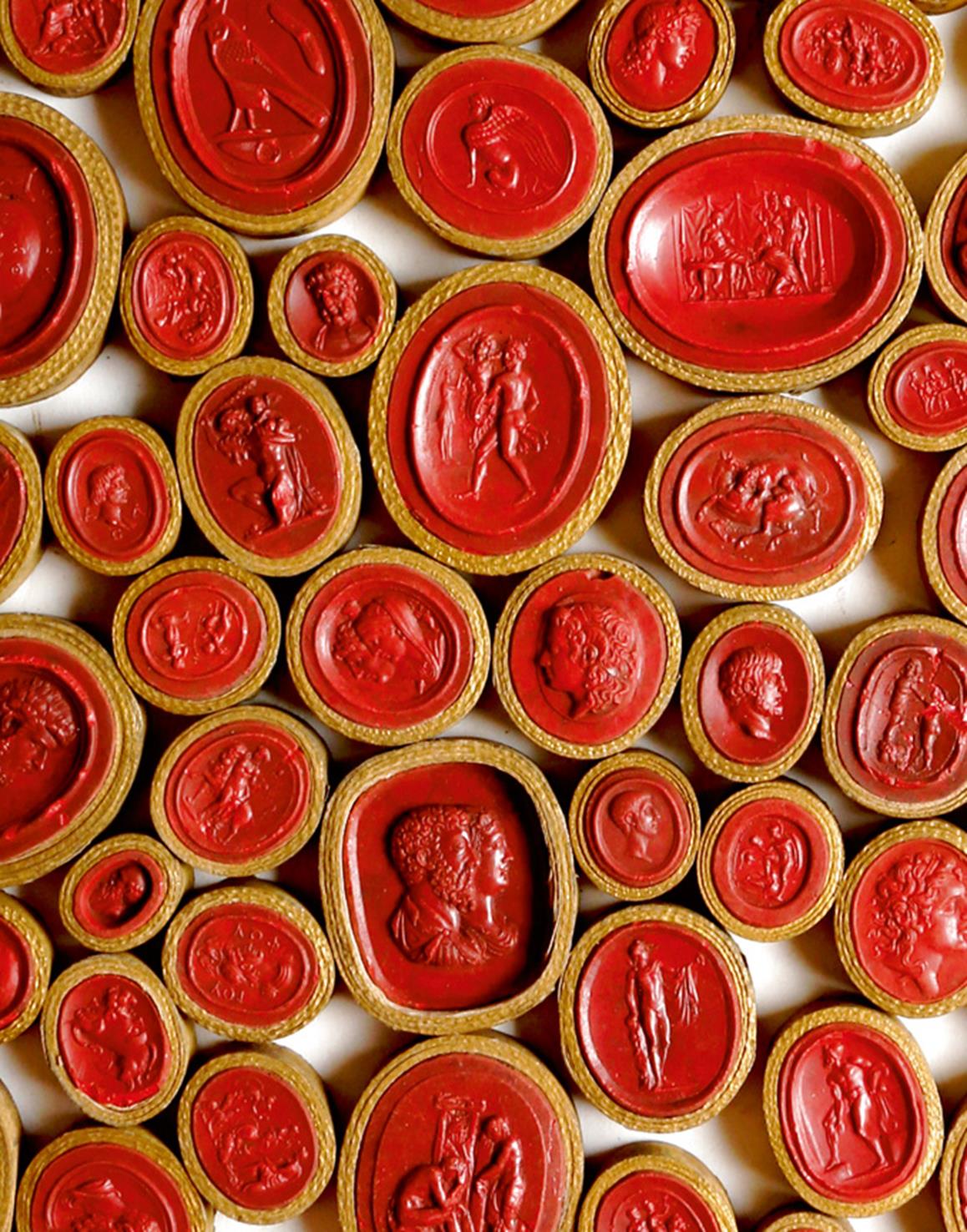 A large collection of early 19th century Grand Tour wax seal intaglios and cameos, of classical