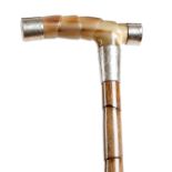 An Edwardian palmwood and silver mounted walking cane, with a horn handle, the silver tips and