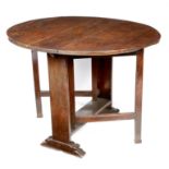 A rare Cromwellian cedar gateleg dining table, the oval drop-leaf top above solid ends and on scroll