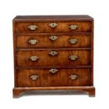 A George II walnut chest, cross and feather banded, the top with a caddy moulded edge, above four
