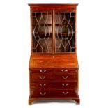 A late George III mahogany and satinwood bureau bookcase, with a pair of astragal glazed doors of