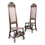 A pair of Queen Anne grained beechwood highback side chairs, each with a pierced scroll and flower