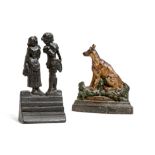 A Victorian cast iron doorstop, in the form of a seated dog, with painted decoration, together