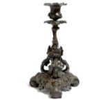 A late 19th century French bronze candlestick, naturalistically cast with grapevine, with a