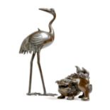 A Japanese bronze incense burner, in the form of a crane, the body with a lid, the underside with