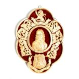 λ A carved ivory mounted commemorative plaque, with a bust of Cromwell, surmounted by a lion crest