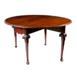 A George II and later mahogany drop-leaf dining table, the oval drop-leaf top with a carved